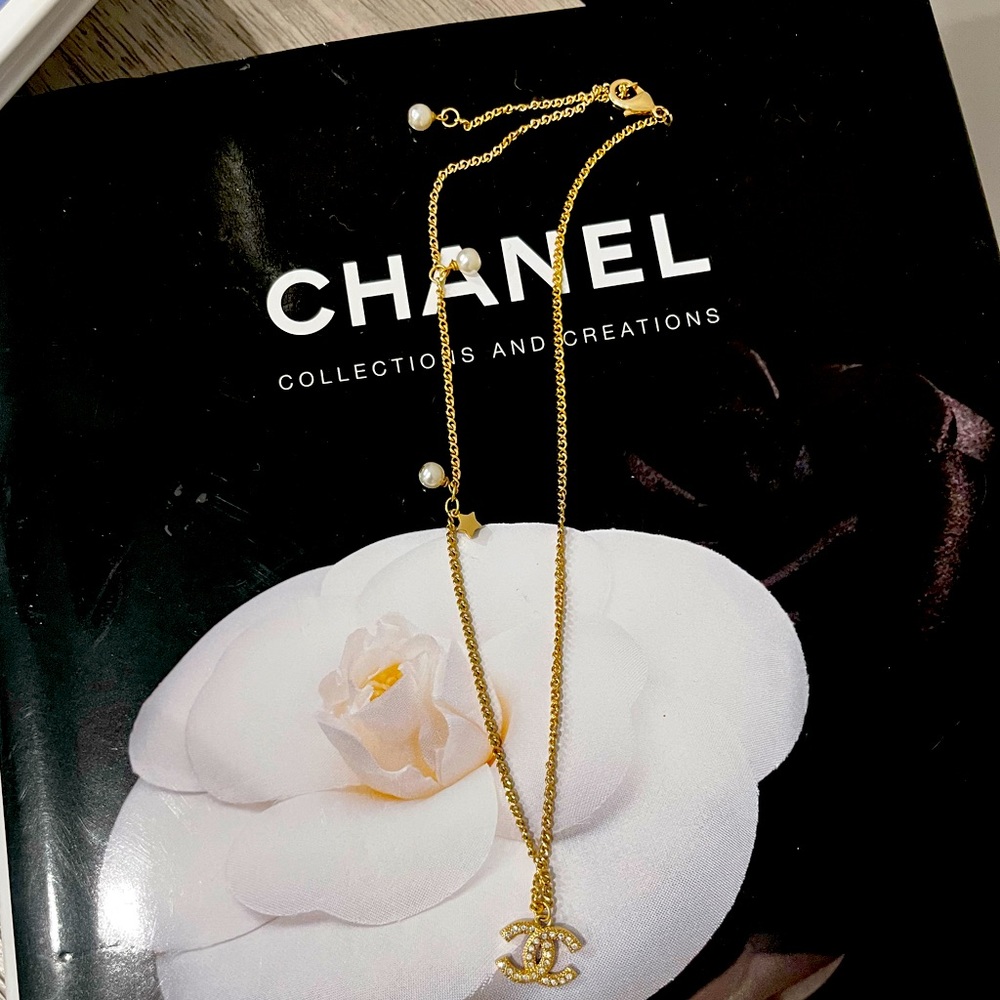 Yellow gold color necklace with pearl and star accents -10 inches